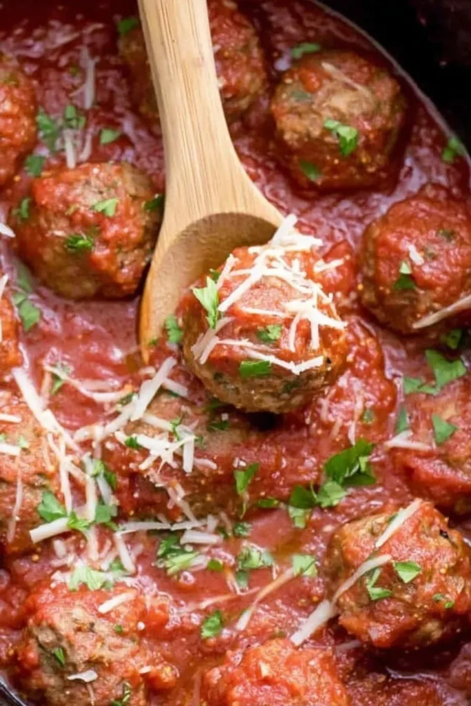 Juicy Italian meatballs simmered in marinara sauce, garnished with parmesan and parsley